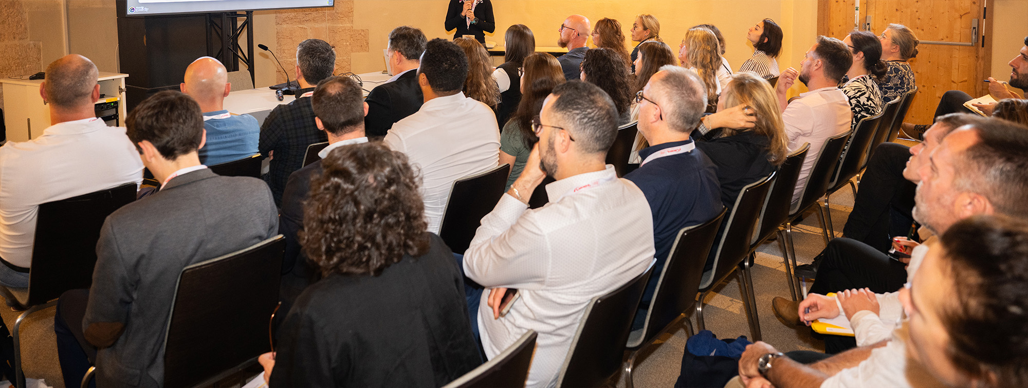 Crowd seated in a conference room