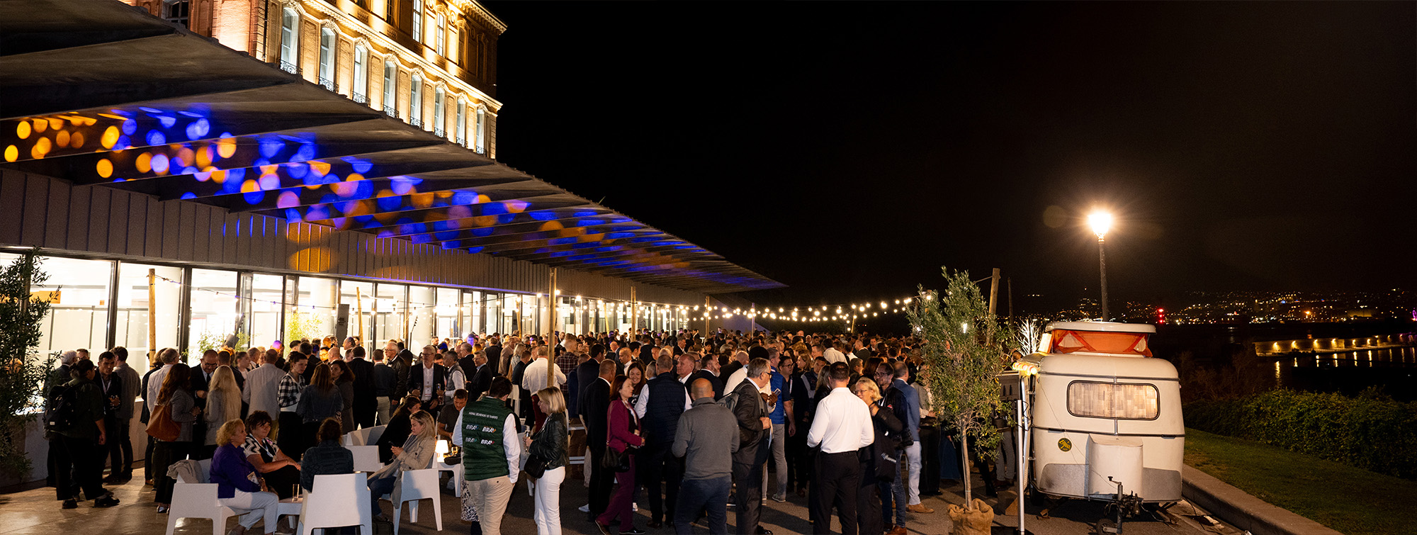 Group of people at an outdoor party outside the show
