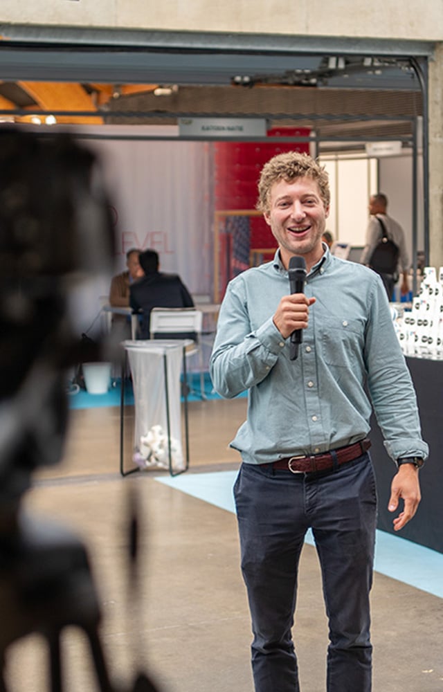 Guest giving an interview with a camera