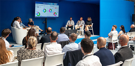 Public attending a conference in a blue room