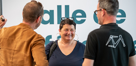 Woman exhibitor with glasses on her head