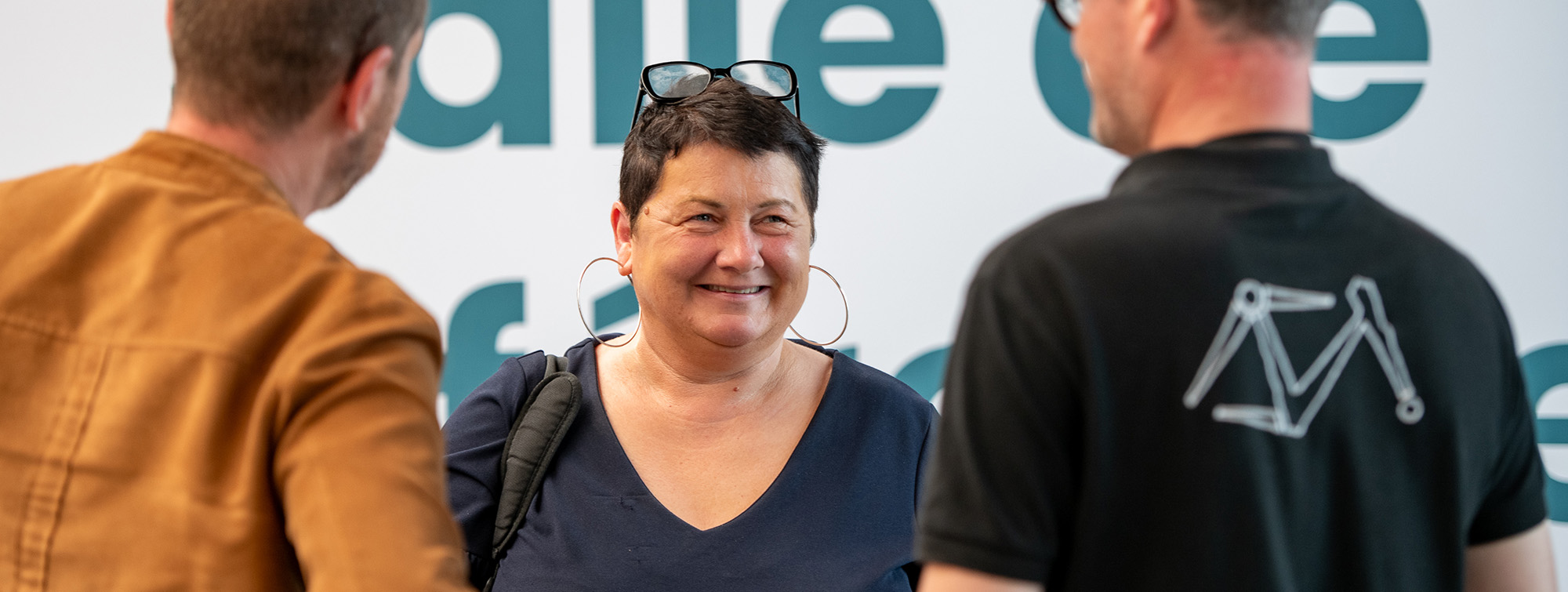 Woman exhibitor with glasses on her head