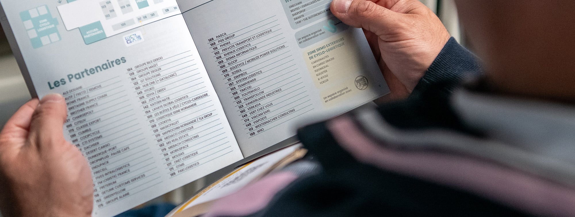 Man holding the trade show program