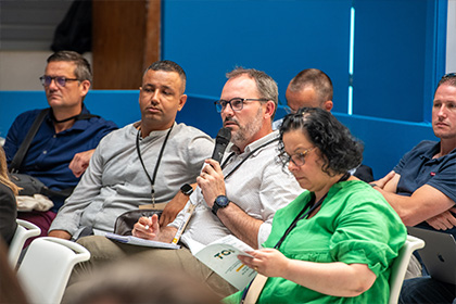 Journalists asking questions at a press conference