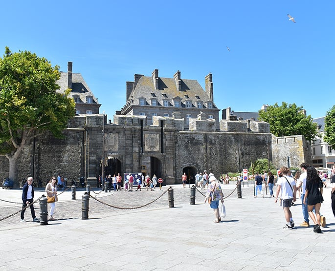 Pedestrians walking around the city of Saint-Malo