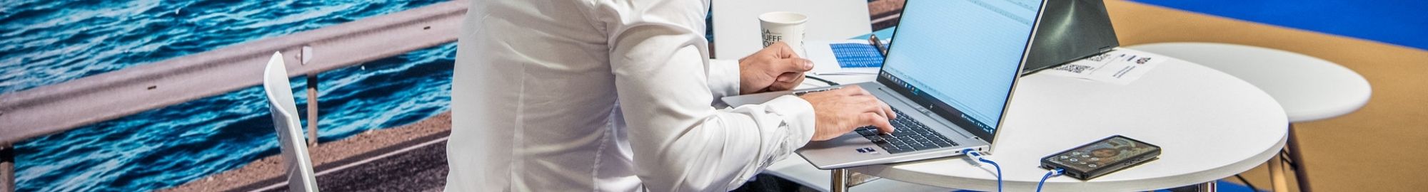 men writing on his computer