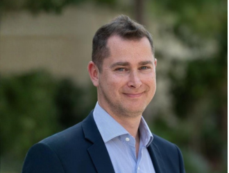 Portrait of Julien CENSIER, a smiling, professional member of the sales team.