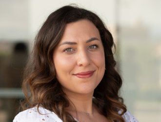 Portrait of Mégane MOKEDDEM, a professional and smiling member of the Guest Experience team.