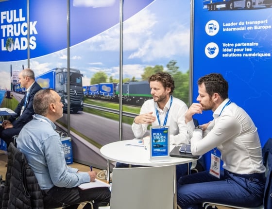 Participants in a one-to-one meeting at the FULL TRUCK LOADS exhibition stand at Top Transport Europe