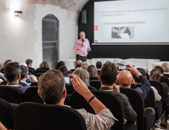 People attending a conference given by a transport expert