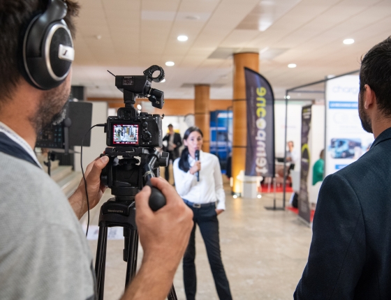 A speaker at Top Transport Europe is filmed and interviewed during the event